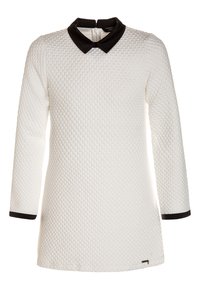 Weißes langärmliges Kleid mit strukturierter Oberfläche, das einen schwarzen Kragen und Manschetten aufweist. Auffälliges gewebtes Muster und ein Reißverschluss auf der Rückseite.