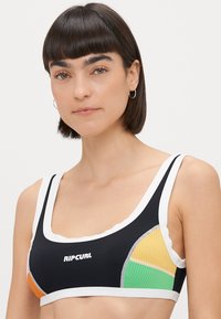 Black swim top with white trim and logo. Features colorful side panels in orange, yellow, and green. Smooth fabric, sporty design.