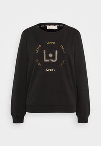 Czarna bluza z okrągłym dekoltem, długimi rękawami i centralnym wzorem logo z dżetów z tekstem w kolorze złotym i białym.