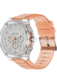 Reloj Armani Exchange con caja de plástico transparente, esfera blanca, acentos plateados, tres subesferas, correa de goma naranja y una pantalla de fecha.