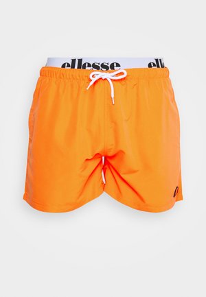 Oranssit uimaportsit, joissa on joustava vyötärö ja valkoinen nyöri, sekä musta "ellesse"-logo, valmistettu sileästä ja kevyestä materiaalista.