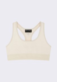 Soutien-gorge de sport beige avec un tissu texturé, design dos nageur, et une bande large et douce avec le nom de la marque en relief. Taille S.