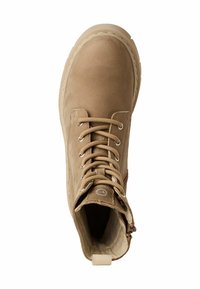 Tan leather ankle boot with beige laces, round toe, zipper on the side, and a textured sole. Circular logo detail on the tongue.