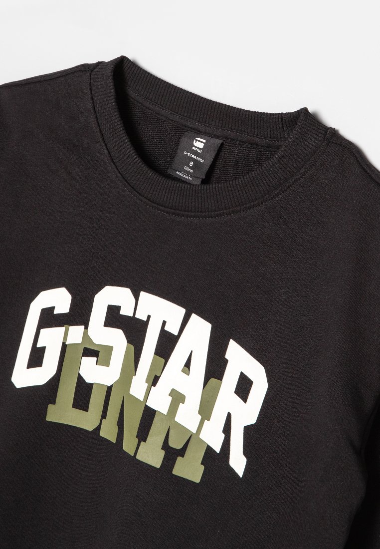 Sudadera negra con "G-STAR RAW" impreso en letras en negrita blancas y verde oliva. Diseño clásico de cuello redondo con puños y dobladillo de canalé.