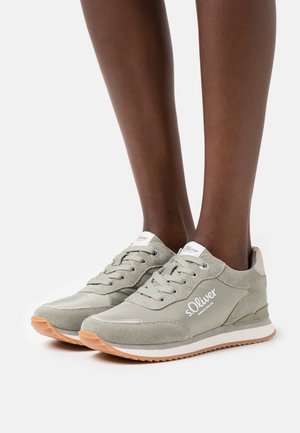 Light grey sneakers with a suede and synthetic upper, round toe, lace-up front, and beige rubber sole; features brand logo on side.