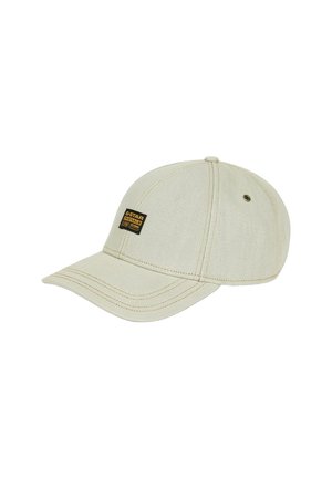 Casquette de baseball beige clair à six panneaux avec une visière courbée et un petit écusson noir du logo G-Star Originals à l'avant gauche.