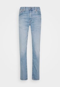 Vaaleansiniset farkut suoran leikkauksen kanssa, joissa on normaali vyötärölauta, viisi taskua ja hienovarainen haalistuminen kankaan pinnalla.