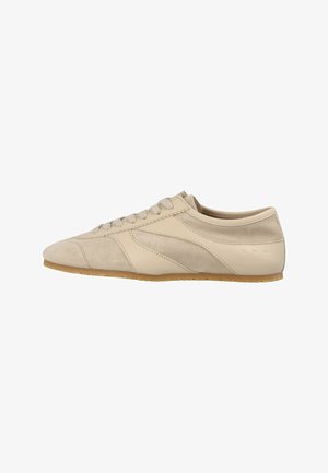 Light beige low-top sneaker with suede and smooth leather panels, lace-up closure, and gum rubber sole, viewed from the outer side.