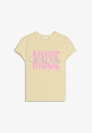 Light yellow short-sleeve T-shirt with large pink "MUSE" text and smaller rhinestone-studded "Wonder" script across the front.