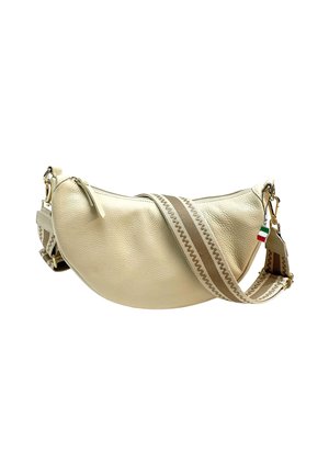 Beige leather shoulder bag with a curved shape, featuring a zipper closure and a patterned adjustable strap. Gold hardware accents included.