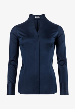 Marineblaues Langarmhemd mit hohem Kragen, mit einem Schlitz vorne und klaren Linien. Hergestellt aus glattem Stoff mit strukturierter Passform.