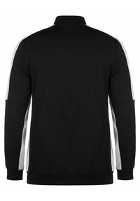 Schwarze Sportjacke mit weißen Seiteneinsätzen, langen Ärmeln, einem Kragen und elastischen Bündchen. Glattes Material mit taillierter Passform.