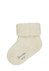 Beige, geripptes Strumpf mit umgeschlagenem Bündchen und glatter Textur. Größenetikett "Sterntaber 13-14" in der Nähe der Zehen aufgedruckt.