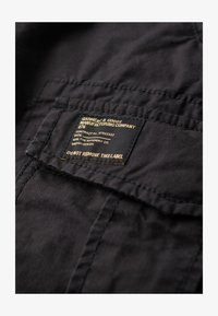 Unselected, washed black