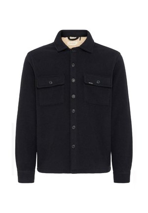 Black fleece jacket with a collar, two chest pockets, and front button closure. The fabric has a soft texture, suitable for layering.