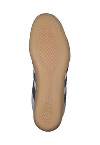 Svart och vit atletisk sko sula med en beige gummiyttersula med ett fiskbensmönster och "adidas"-logotyp.