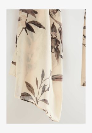 Krémszínű áttetsző sál barna árnyalatú virágmintával. Könnyű anyag, puha tapintás, enyhén rojtos szegéllyel.