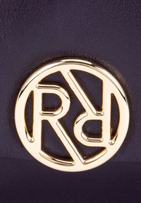 Gold circular logo with the letters "R" and "B" intertwined, set against a dark purple textured background.