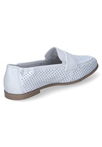 White perforated leather slip-on shoe with a flat brown sole, featuring a soft toe and side panel detail for added comfort.
