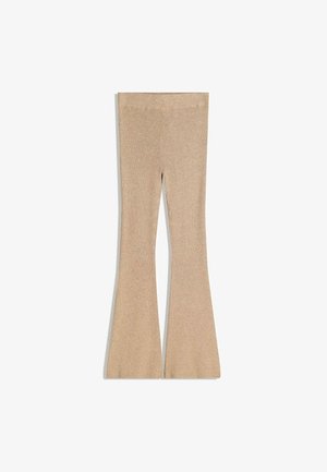 Beige ribbed flared leggings with a high waistband. The fabric texture is soft and stretchy, tapering from the knee to the hem.