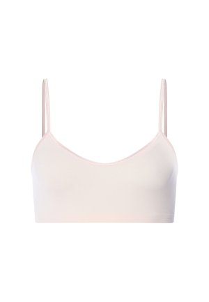 Světle růžová bezešvá podprsenka s tenkými nastavitelnými ramínky a hladkým, měkkým povrchem látky.