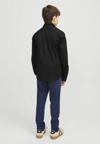 Jack & Jones Junior JJEAXEL czarny