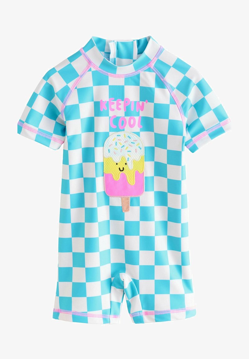 Tutina a maniche corte a quadri blu e bianchi con cuciture rosa, una toppa con un ghiacciolo sorridente e il testo "KEEPIN' COOL" in lettere rosa.