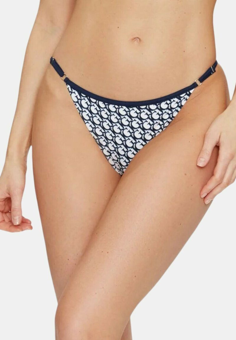 Mutandine bikini a motivi blu navy e bianche con vita bassa, caratterizzate da dettagli in metallo ai lati e un tessuto morbido per il massimo comfort.