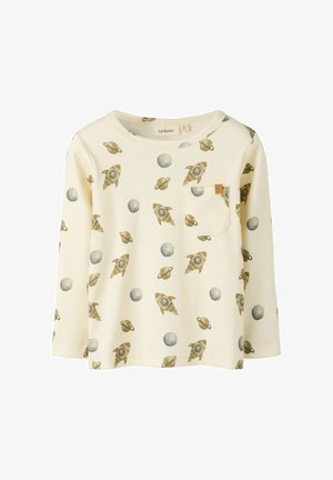 Langærmet creme-farvet bomulds skjorte med raket- og planetmønstre. Har en frontlomme og rund hals. Blød tekstur og afslappet pasform.