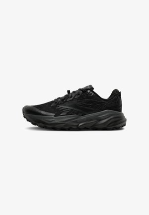 Scarpa sportiva nera con tomaia in rete, sovrapposizioni testurizzate e suola ammortizzata. Presenta un design con lacci e un tallone rinforzato per supporto.
