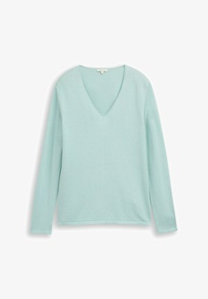 Jasnoniebieska bluzka z długim rękawem i dekoltem w serek o miękkiej fakturze. Prosty design z czystymi liniami i luźnym krojem.