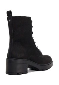 Black suede ankle boot featuring a textured surface, lace-up front, and a chunky rubber heel with a treaded sole.