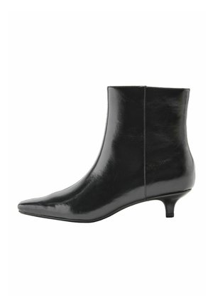 Black shiny leather ankle boot with pointed toe and short kitten heel, side view on white background.