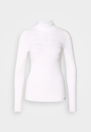 Balts garām piedurknēm turtlenecks tops ar ribotu tekstūru, pieguļoša dizaina un horizontālu svītru rakstu krūšu apgabalā.