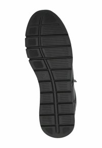 Semelle de chaussure noire avec un motif texturé comprenant des grips rectangulaires et circulaires, conçue pour l'adhérence. Taille indiquée comme 37.