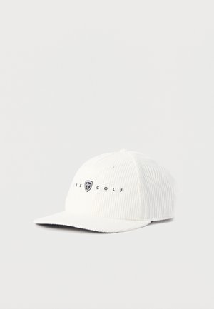 Gorra de béisbol de pana blanca con texto y logo bordados "Nike Golf" en la parte frontal, visera plana, sobre un fondo liso.