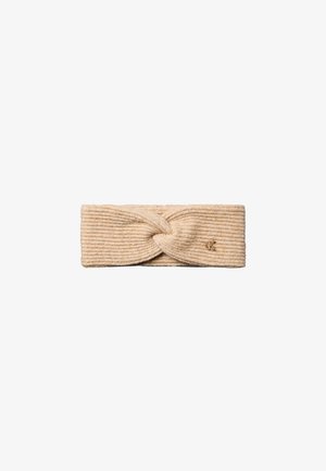 Bandeau beige en maille côtelée avec un nœud torsadé et un petit logo métallique sur un côté.