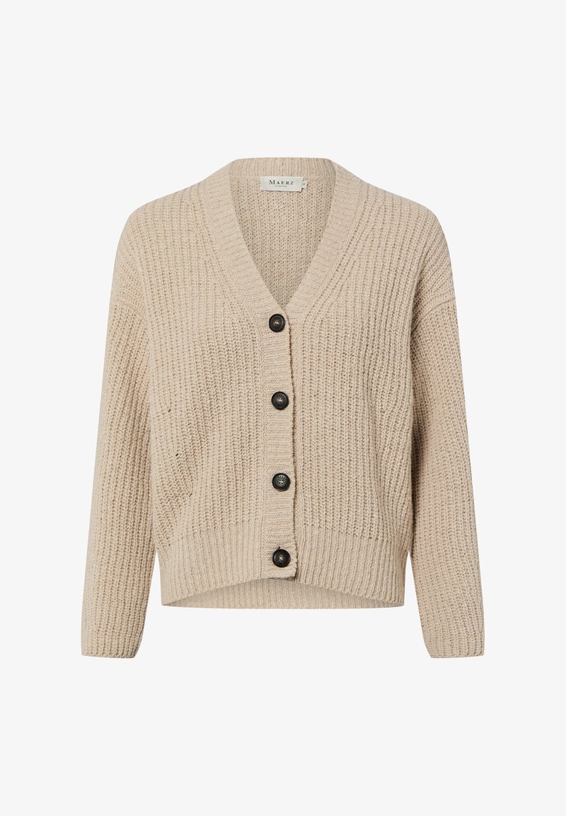 Beżowy sweter na drutach z dekoltem w serek, z pięcioma czarnymi guzikami z przodu i prążkowanym wzorem. Krótszy fason z długimi rękawami.