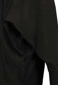 Black knit garment featuring a draped design, smooth texture, gathered shoulder detail, and ribbed cuffs.