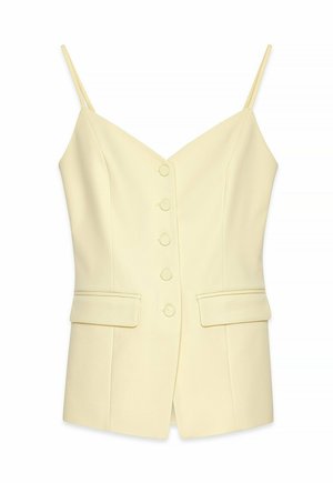 Top giallo senza maniche con scollatura a V, bottoni frontali, due tasche laterali e cuciture strutturate. Realizzato in tessuto testurizzato.