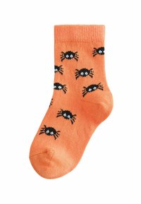 Orange Baumwollsocke mit einem gerippten Bündchen, das ein Muster aus schwarzen Krabben mit weißen Augen zeigt. Die Textur ist glatt und leicht.