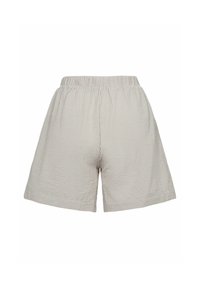 Pantalones cortos a cuadros color beige claro, confeccionados en una tela suave, con cintura elástica y bolsillos laterales, de corte relajado y textura suave.