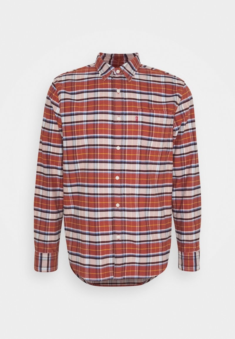 Chemise à manches longues avec boutons, motif à carreaux rouge, blanc et bleu, une poche poitrine et col pointu.