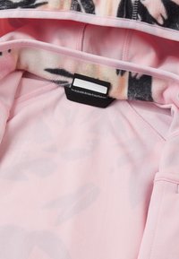 Fleece-lined hoodie in soft pink with floral pattern details. Includes a tag stating "sustainable design from Finland." Smooth texture.