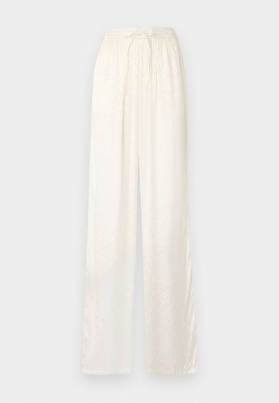 White, loose-fitting pants with a lightweight, satin-like texture. Feature an elastic waistband with a tied drawstring and subtle pattern.