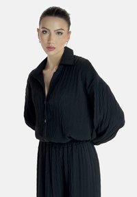 Elara LANGESSET - Pantalon classique - schwarz