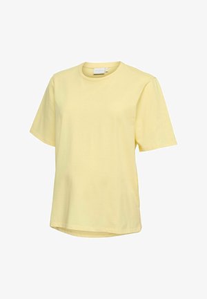 T-shirt en coton jaune clair à manches courtes, col rond et coupe légèrement ample, présenté sur un fond blanc.