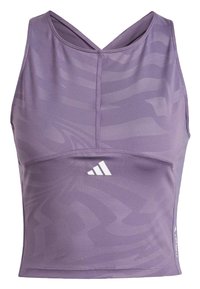 Crop top atlético morado hecho de una tela suave. Presenta un diseño de cuello en V, un suave patrón ondulado, y un logo de Adidas en blanco en la parte inferior delantera.
