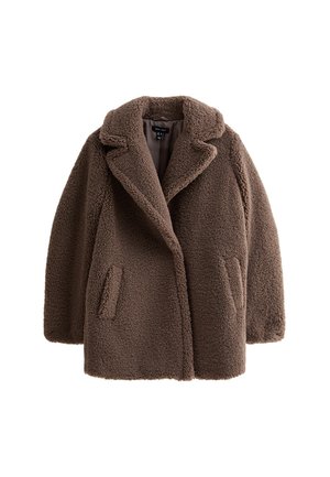 Cognackleurige teddyjas met een gestructureerde buitenkant, brede revers en zijzakken. Oversized pasvorm en eenvoudig ontwerp, dat het zachte, pluizige materiaal benadrukt.