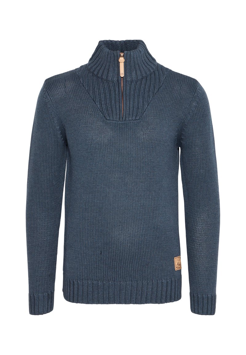 Pull en tricot bleu marine, présente un col zippé à moitié, des poignets et un ourlet côtelés, avec un motif texturé et un petit patch en cuir.